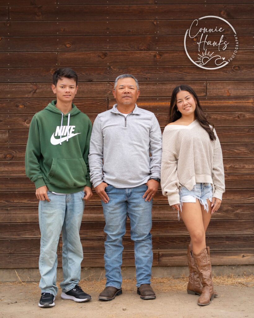 Family photos at Penasquitos Canyon, San Diego, California. Family with teens in wooded tree area, pepper trees, cactus garden, white fencing and rustic vibes.