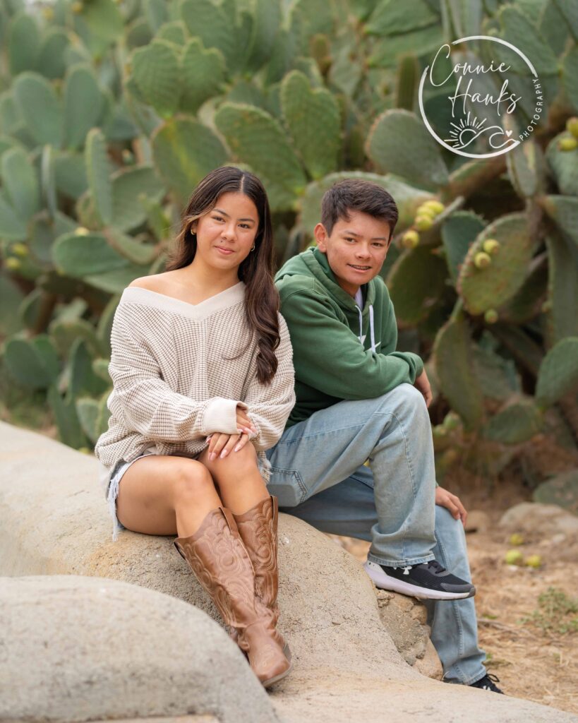 Family photos at Penasquitos Canyon, San Diego, California. Family with teens in wooded tree area, pepper trees, cactus garden, white fencing and rustic vibes.