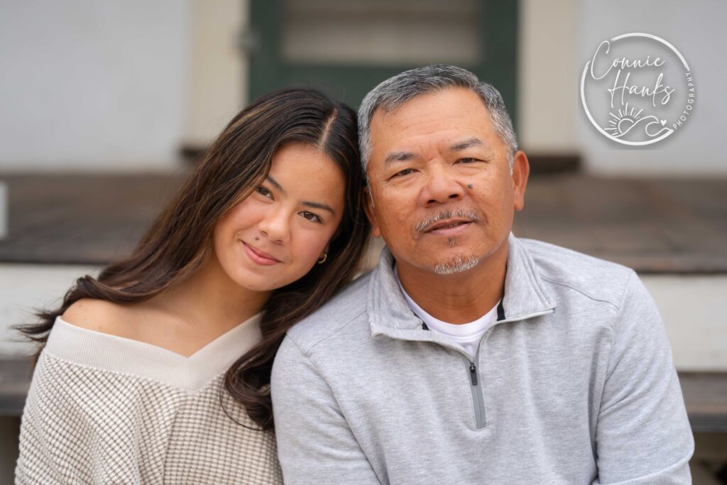 Family photos at Penasquitos Canyon, San Diego, California. Family with teens in wooded tree area, pepper trees, cactus garden, white fencing and rustic vibes.