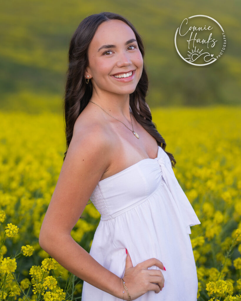 Senior photos wildflower field in Chula Vista, San Diego, California. Gorgeous girl in mustard seed wildflowers.