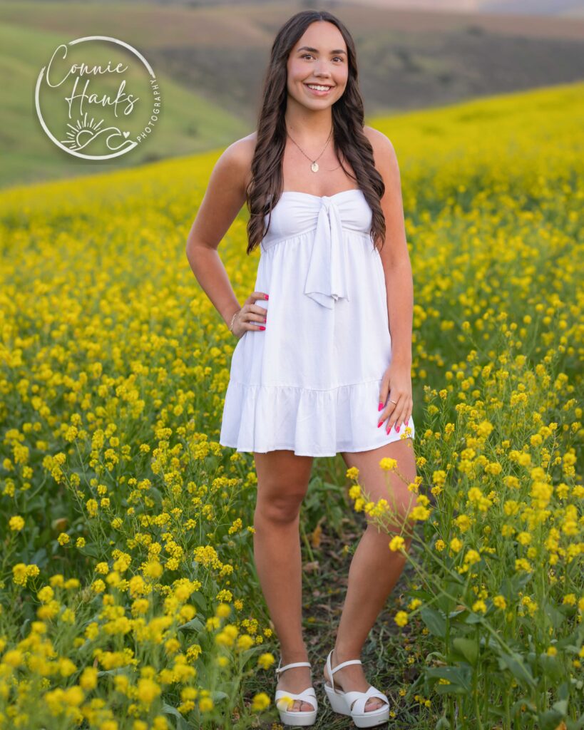 Senior photos wildflower field in Chula Vista, San Diego, California. Gorgeous girl in mustard seed wildflowers.