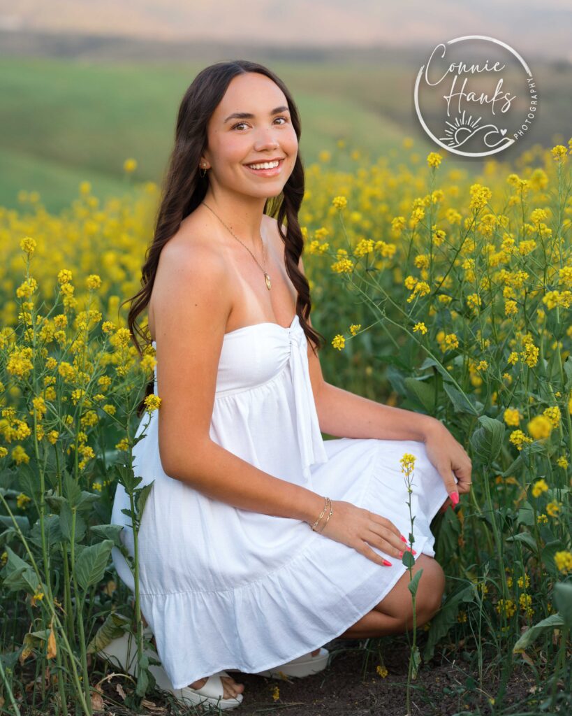 Senior photos wildflower field in Chula Vista, San Diego, California. Gorgeous girl in mustard seed wildflowers.