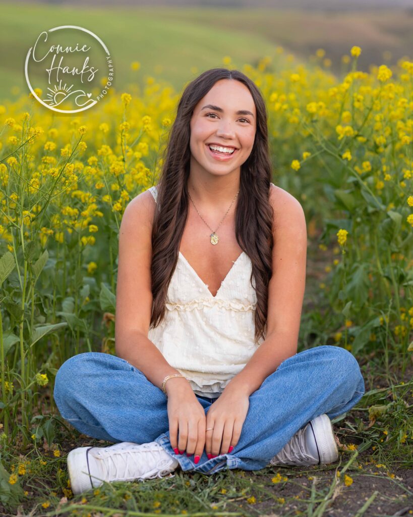 Senior photos wildflower field in Chula Vista, San Diego, California. Gorgeous girl in mustard seed wildflowers.