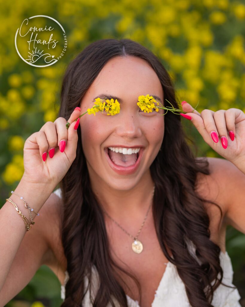 Senior photos wildflower field in Chula Vista, San Diego, California. Gorgeous girl in mustard seed wildflowers.